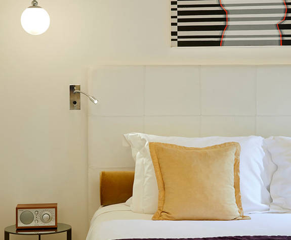 The Excelsior Hotel Junior Suite bed decorations and amenities