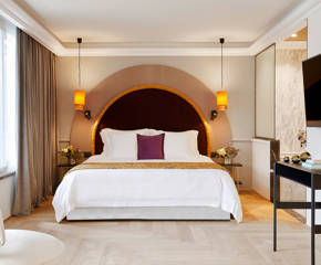 The Excelsior Hotel Penthouse Suite double bed and decorations