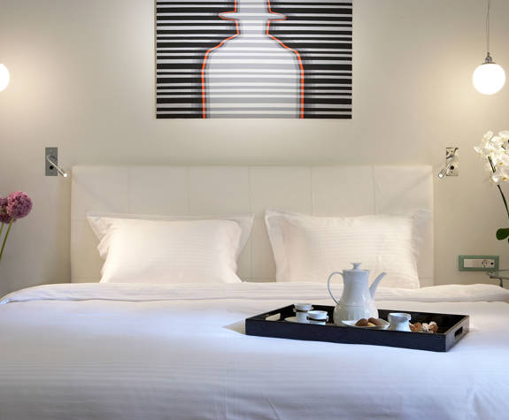 The Excelsior Hotel Classic Room double bed with a breakfast tray on it